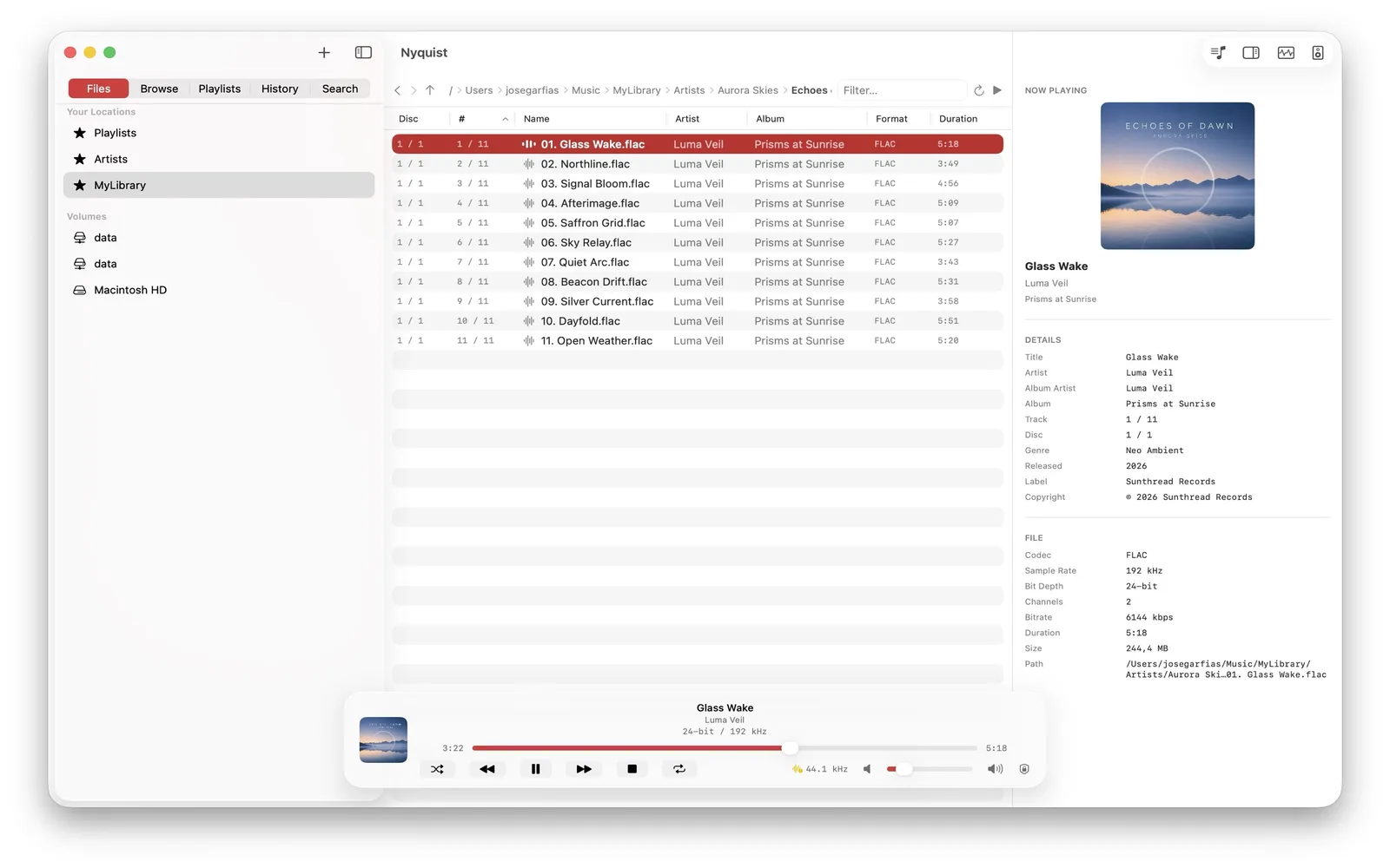 Nyquist on macOS browsing an album track list with format, quality, and duration columns and a full metadata inspector.
